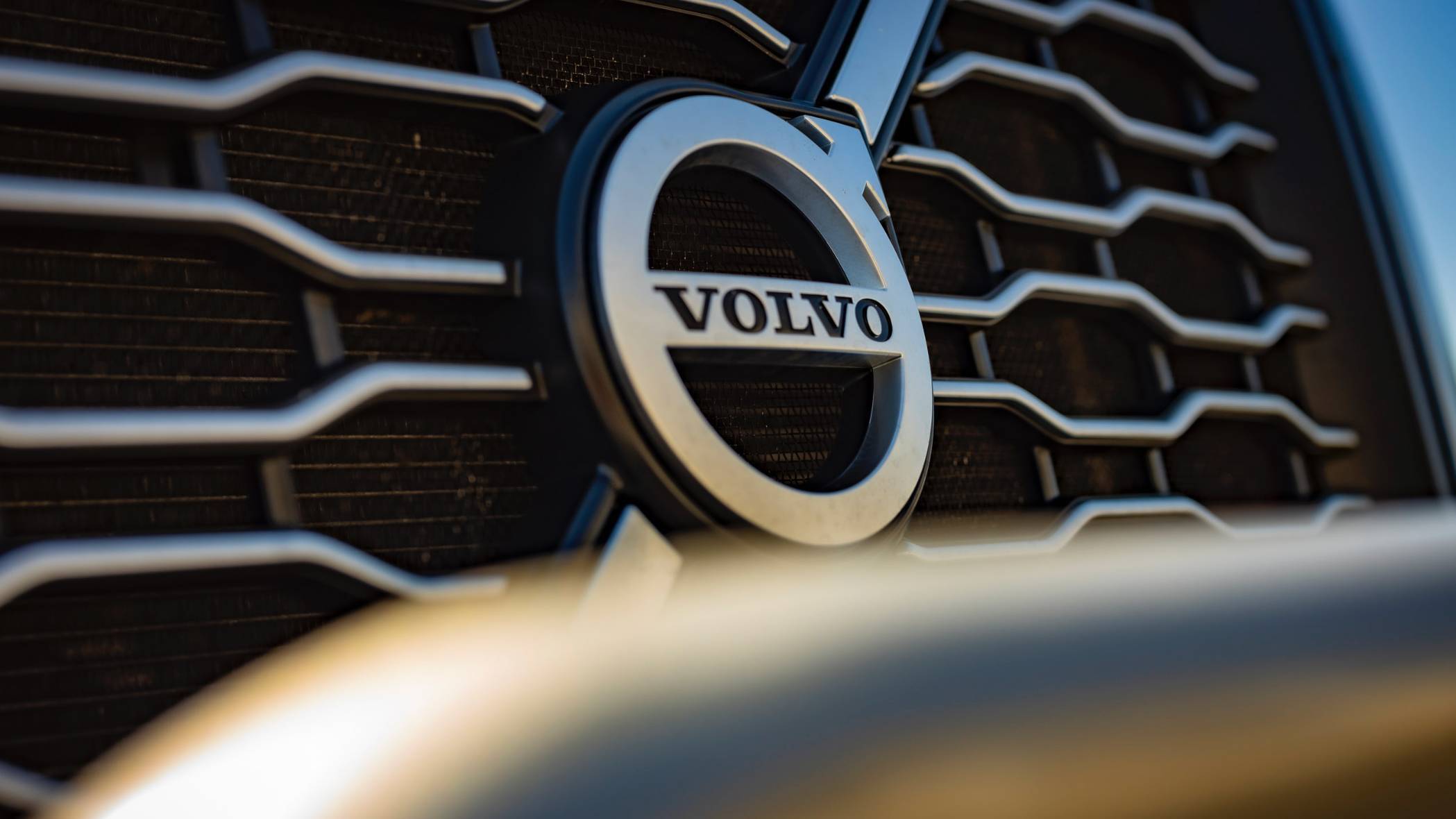 Close-up of a Volvo logo on the grill of a truck