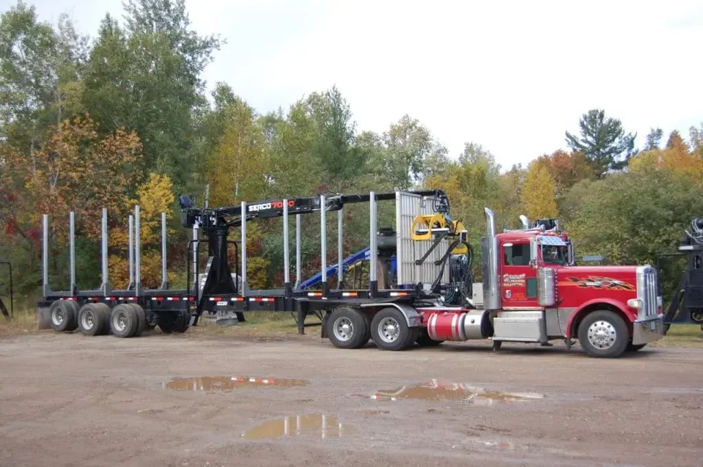 A Serco 7000 loader being delivered on a read truck