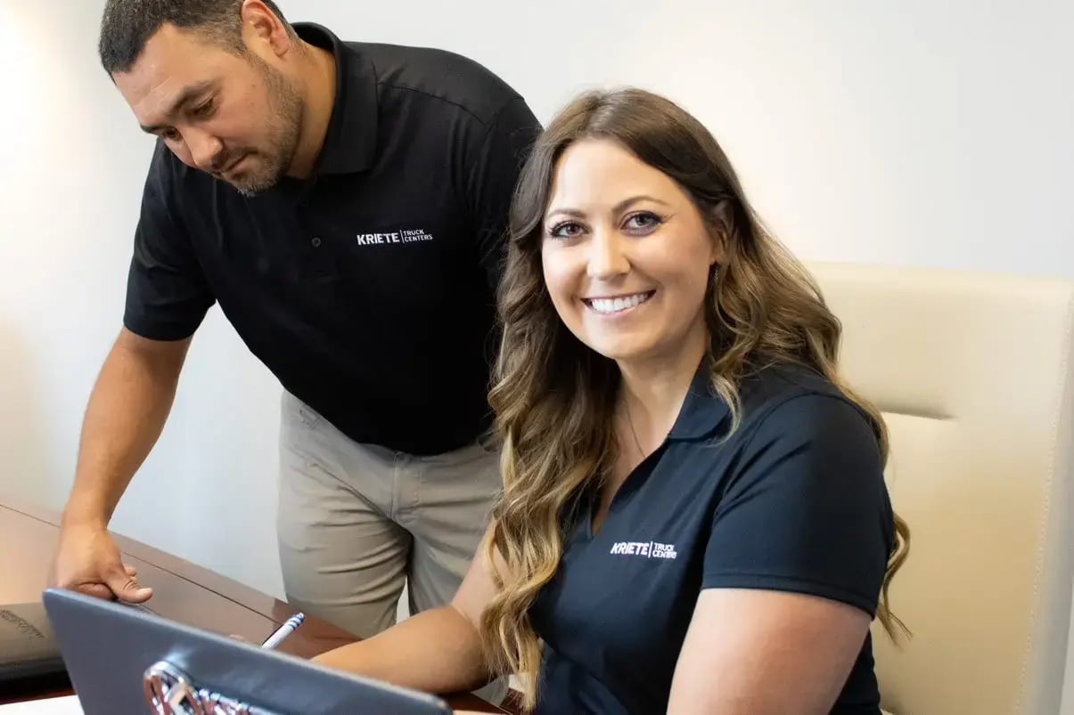 Two members of the Kriete finance and insurance team, smiling at the camera