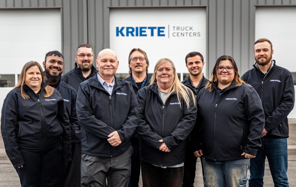 Kriete employees gathered for a group photo outside a Kriete warehouse