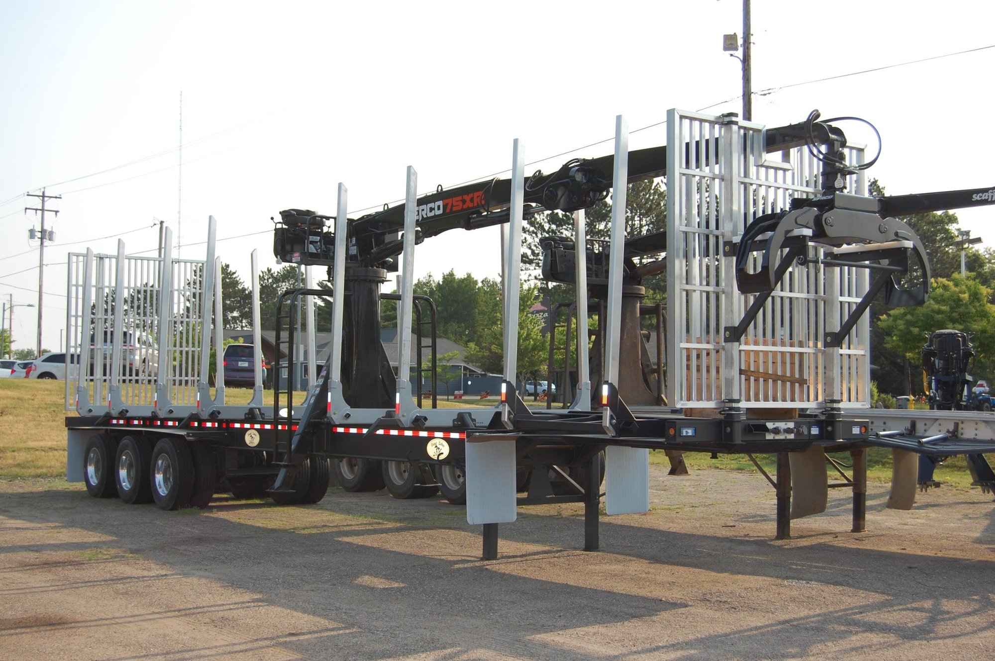 A 2023 Great Lakes Manufacturing 7-inch drop log crib trailer
