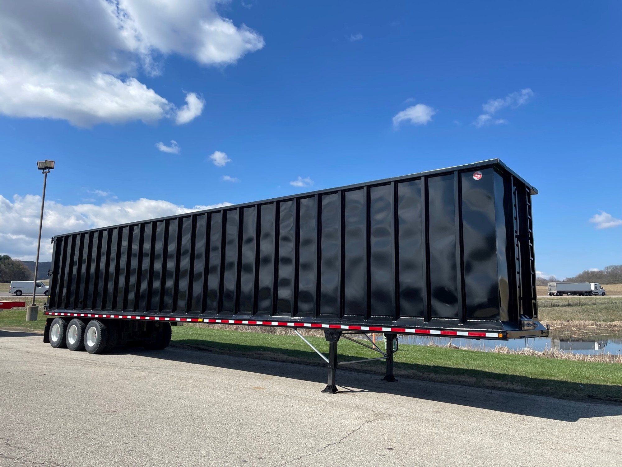 A black 2023 Cross Country 533SH scrap hauler trailer