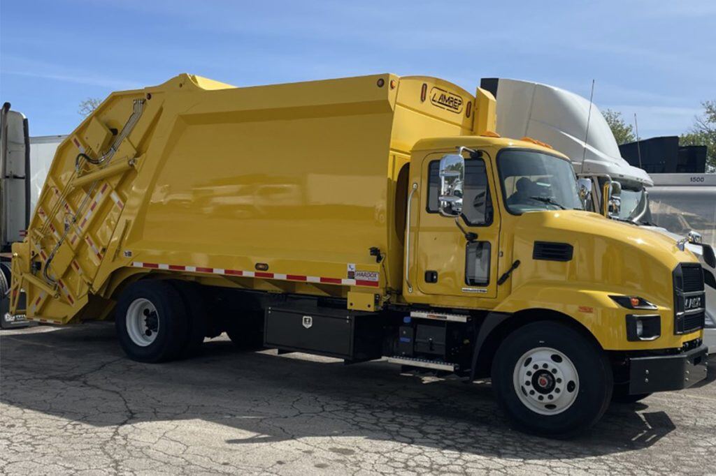 A bright yellow City of Milwaukee Mack dump truck