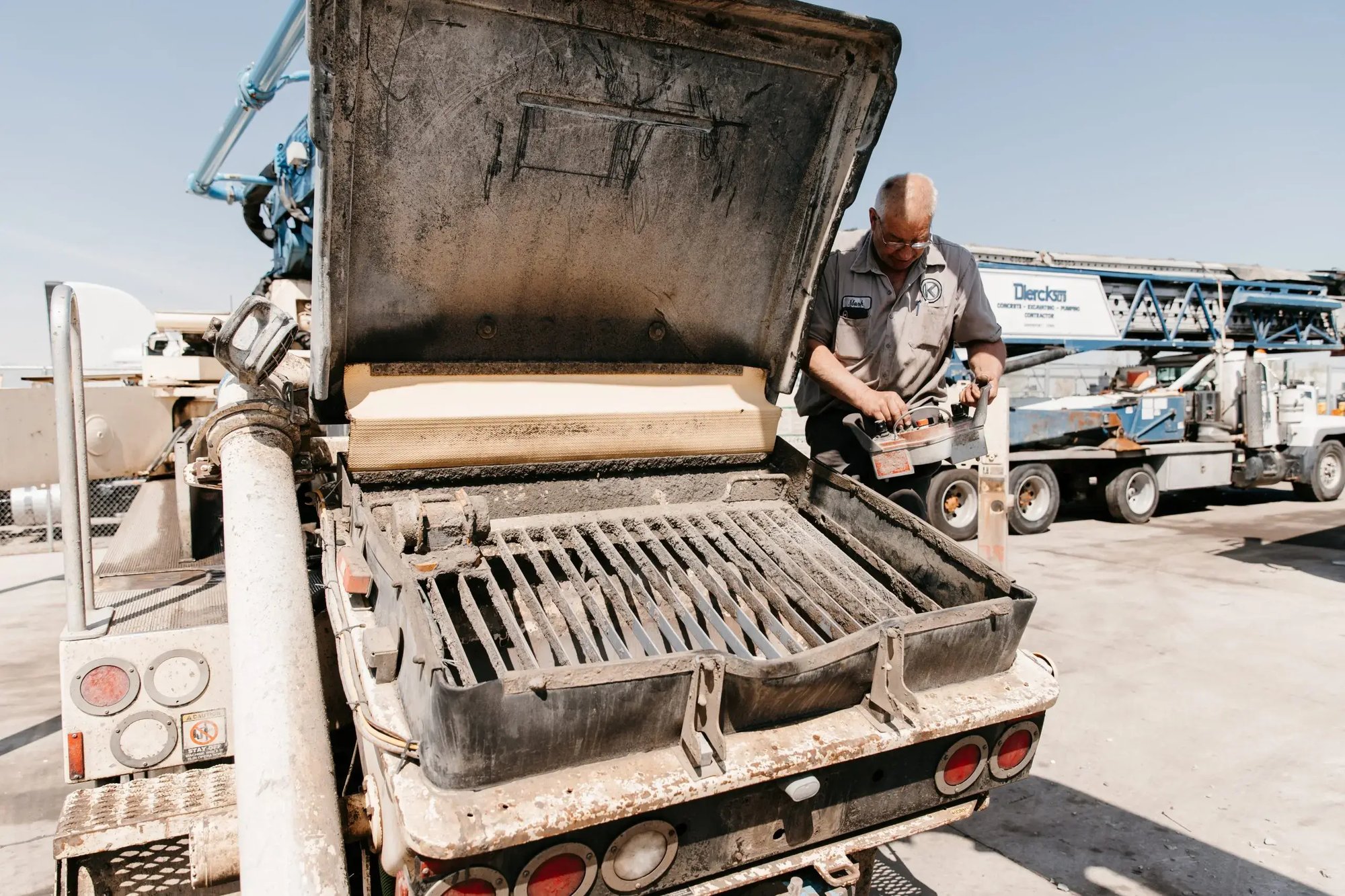 Mark Kelemen looking under the hood of a truck