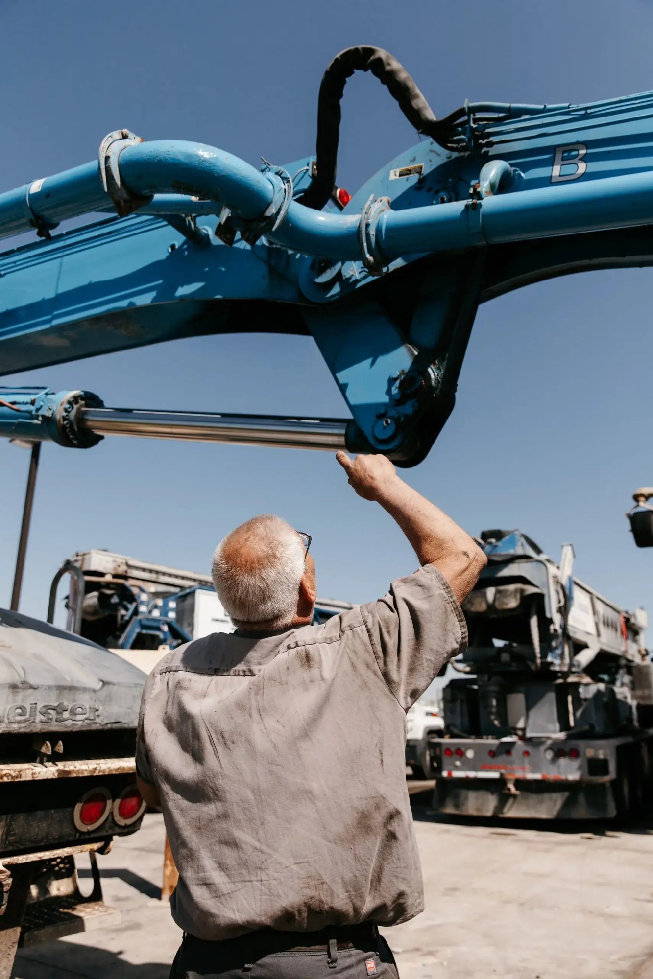 Mark Kelemen inspecting the underside of a boom