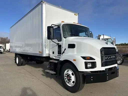 White Mack truck, side-on, with an attached shipping container