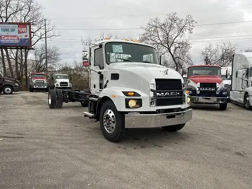 White Mack truck in a parking lot