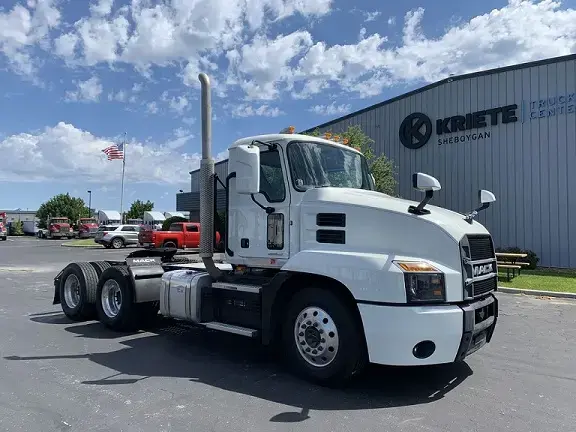 Pristine white Mack truck seen from the side
