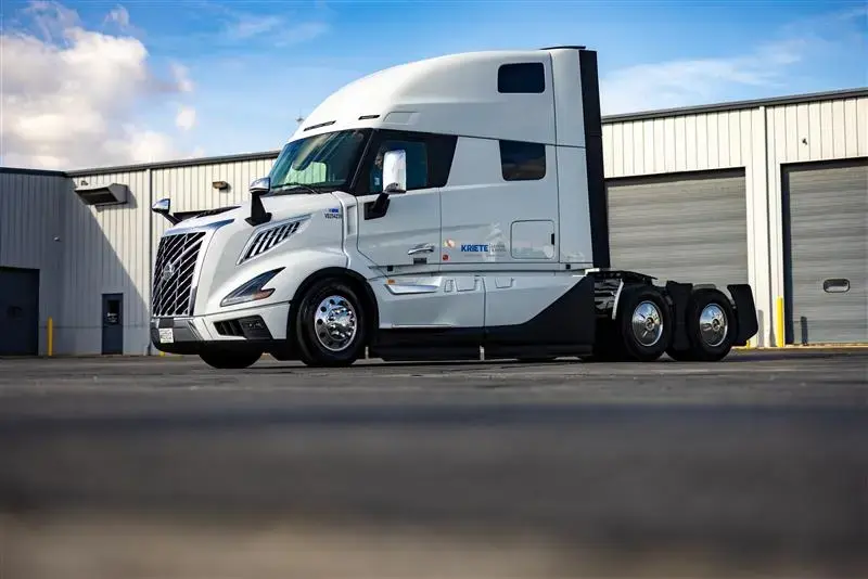 White Volvo VNL seen side-on outside a Kriete facility
