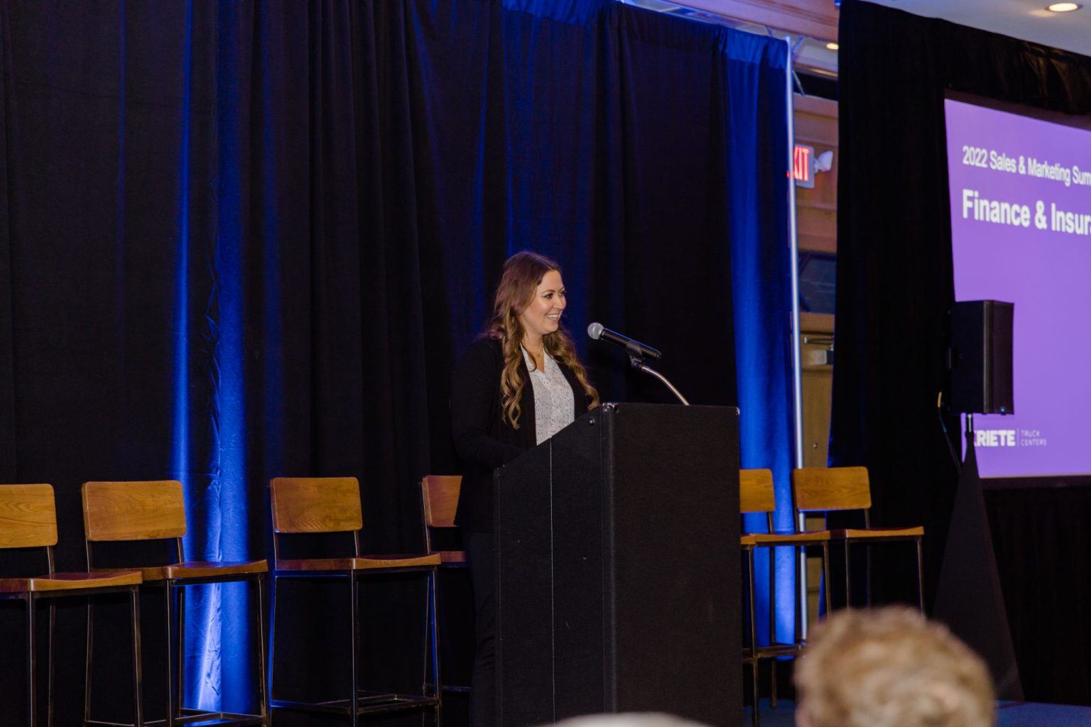 Taylor Pfeuti, Finance and Insurance Manager, delivers a speech on Day 1 of the Sales Summit.