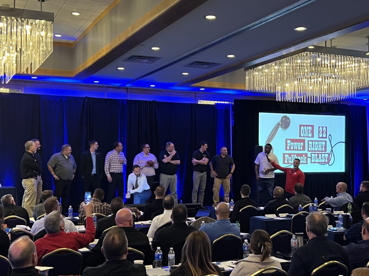 Special Guest Ron Dayne, Wisconsin Football Legend & Heisman Trophy Winner, takes part in a teamwork exercise with Kriete team members.