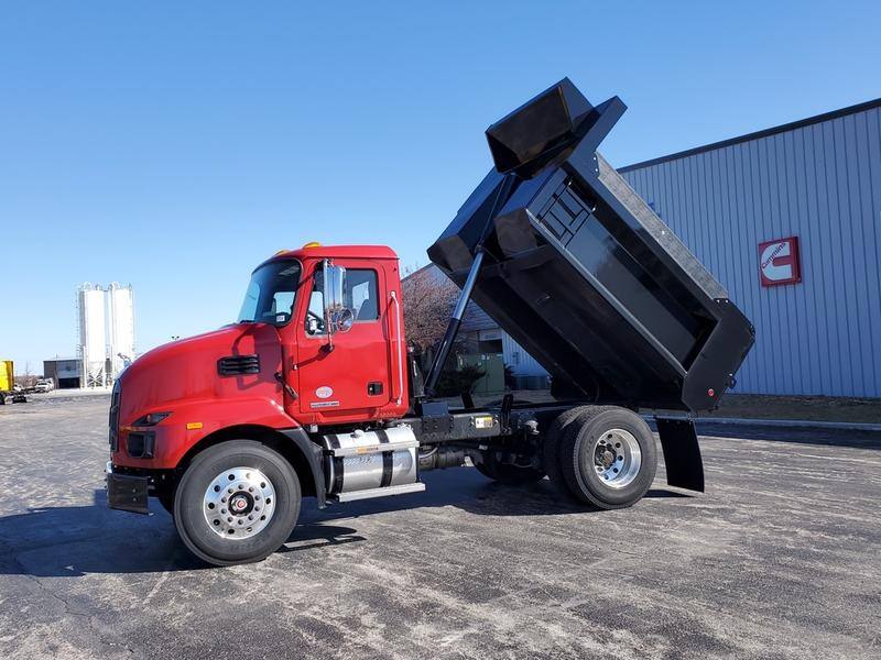 A black Cross Country CCMD dump body with straight gate, reclined
